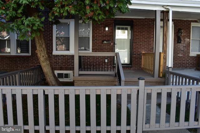 doorway to property with a porch