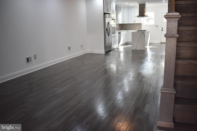 unfurnished living room featuring dark hardwood / wood-style flooring