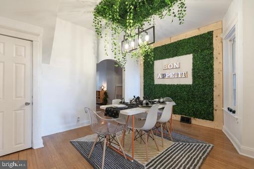 dining space featuring wood-type flooring