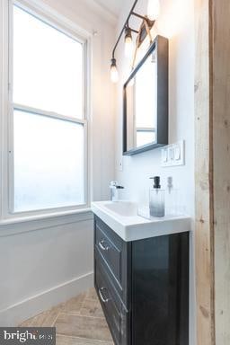 bathroom with vanity and a wealth of natural light