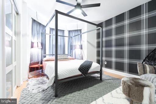 bedroom featuring ceiling fan and hardwood / wood-style flooring