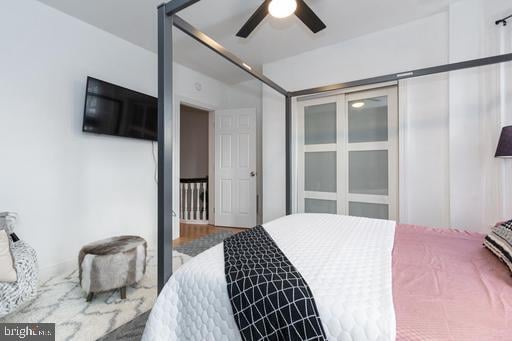 bedroom featuring ceiling fan and hardwood / wood-style flooring