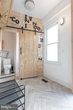 interior space with a barn door