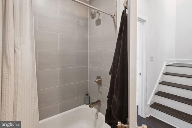 bathroom with shower / bath combination with curtain