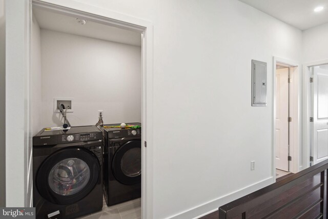 laundry room featuring washer and dryer and electric panel