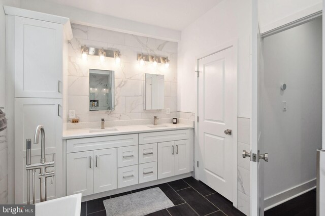 bathroom with vanity and backsplash