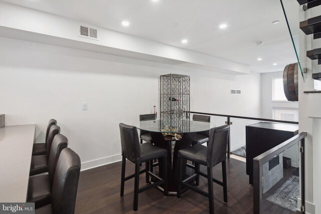 dining space featuring dark hardwood / wood-style floors