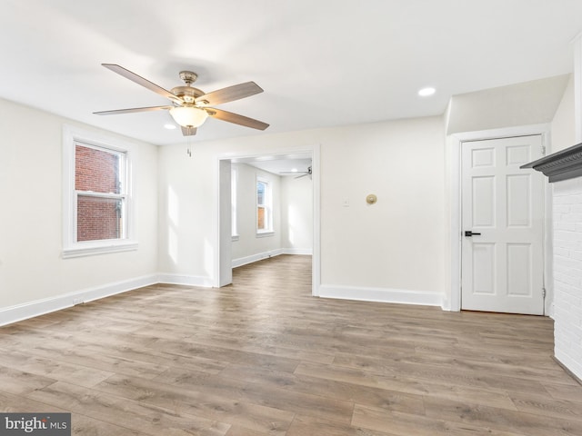 unfurnished room featuring ceiling fan and hardwood / wood-style flooring