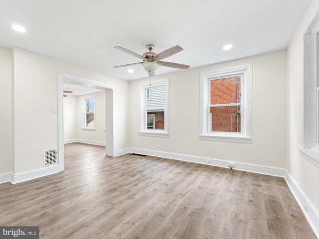 unfurnished room featuring ceiling fan and light hardwood / wood-style floors