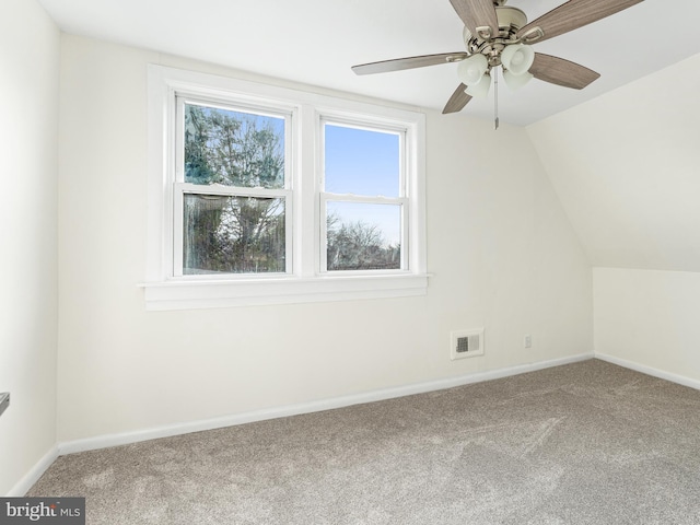 additional living space featuring carpet flooring, ceiling fan, and vaulted ceiling