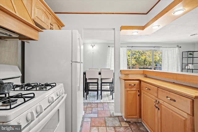 kitchen with light brown cabinetry, premium range hood, butcher block counters, and white gas stove