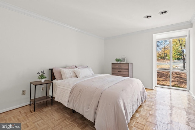 bedroom with light parquet floors and crown molding