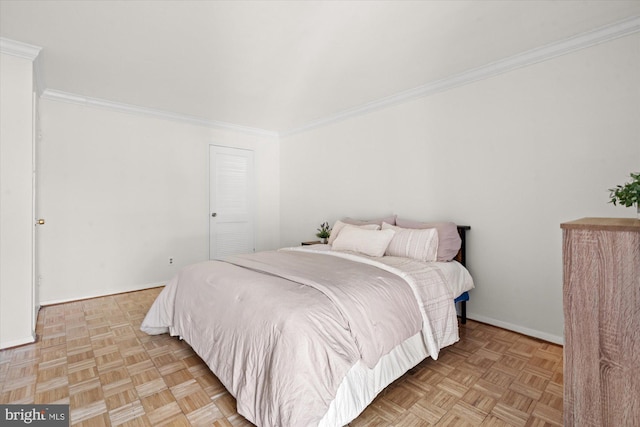 bedroom featuring light parquet flooring and ornamental molding