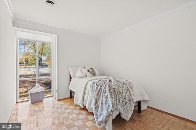 bedroom featuring crown molding and light parquet flooring