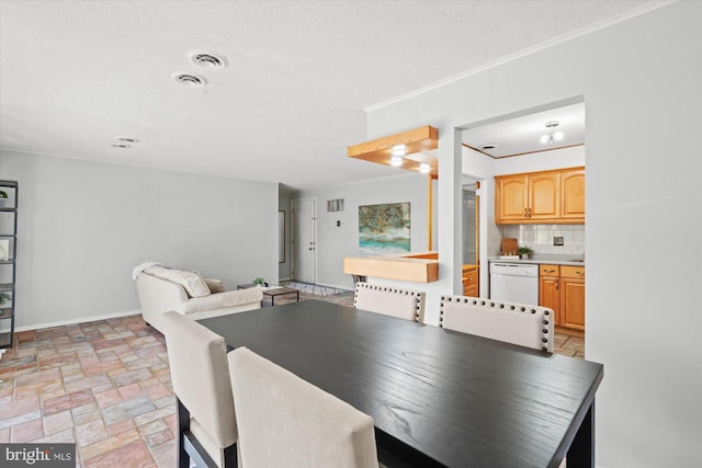 dining room with a textured ceiling