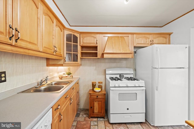 kitchen with white appliances, light brown cabinetry, custom exhaust hood, and sink