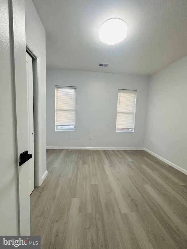 empty room with light wood-type flooring