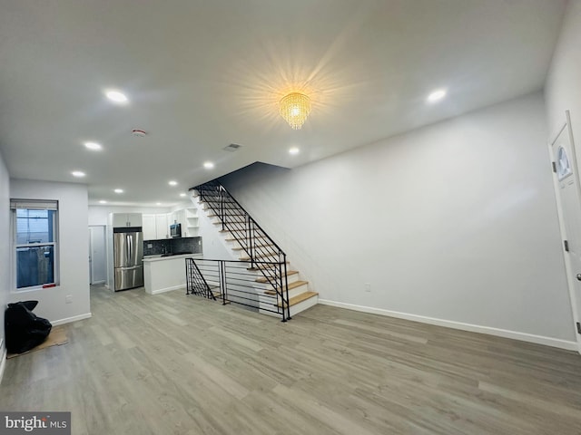 living room with light hardwood / wood-style floors