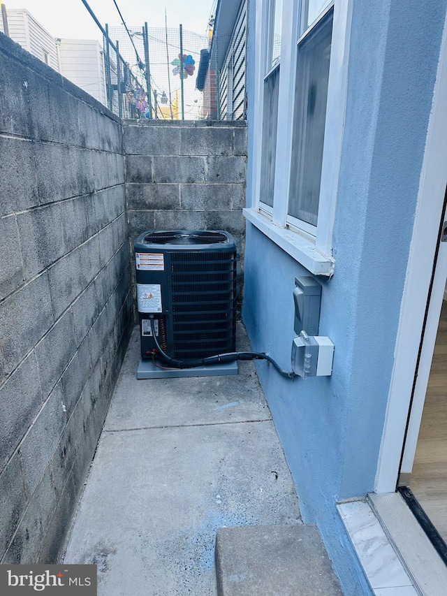 exterior details with concrete floors and cooling unit