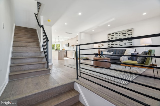 staircase featuring hardwood / wood-style flooring