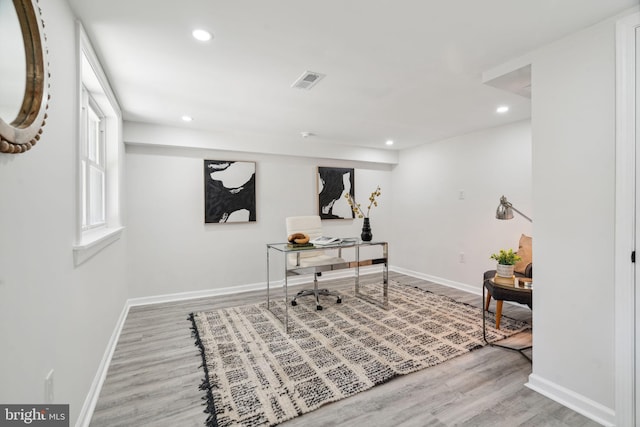 home office with hardwood / wood-style floors