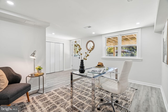 office space with light hardwood / wood-style flooring