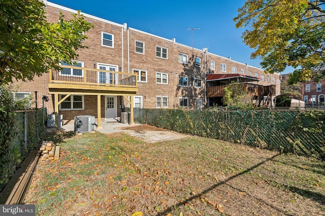 back of property featuring central AC unit