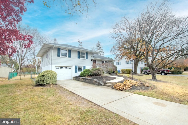 view of front facade with a garage and a front yard