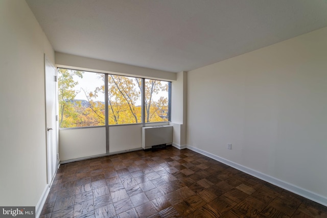 1301 Delaware Ave SW Unit N616, Washington, DC 20024 - spare room with baseboards and radiator heating unit
