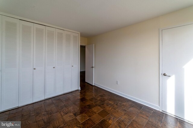 1301 Delaware Ave SW Unit N616, Washington, DC 20024 - unfurnished bedroom with baseboards and a closet