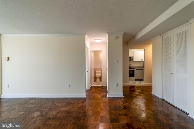 interior space featuring crown molding, dark parquet floors, and a textured ceiling