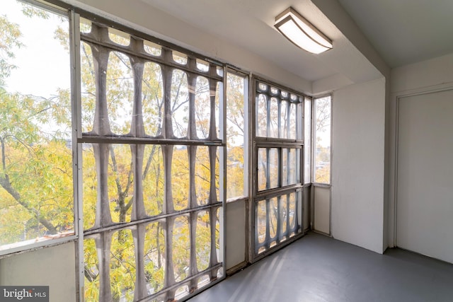 unfurnished sunroom with a healthy amount of sunlight