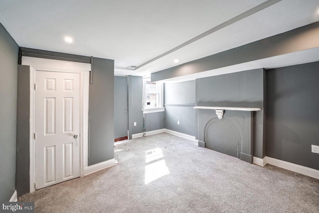 basement featuring carpet flooring