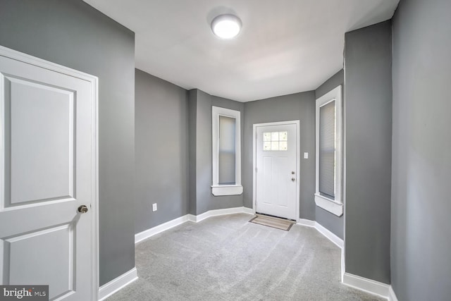 entrance foyer with light carpet