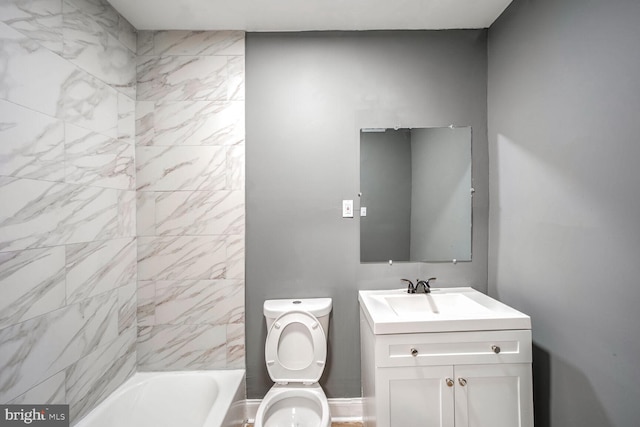 full bathroom with vanity, toilet, and tiled shower / bath