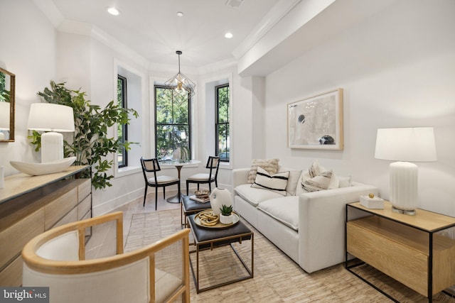 living room featuring crown molding and light wood-type flooring