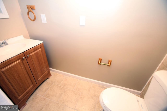 bathroom with tile patterned floors, vanity, and toilet