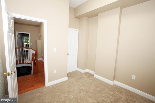 unfurnished bedroom featuring light colored carpet