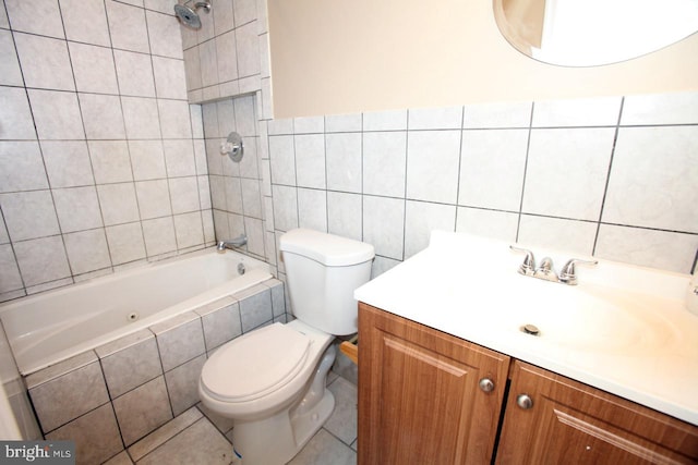 full bathroom featuring tiled shower / bath combo, tile patterned flooring, toilet, vanity, and tile walls