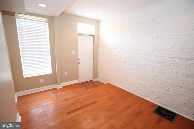 foyer entrance with wood-type flooring