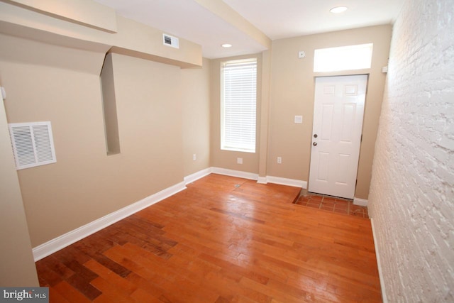 foyer entrance with hardwood / wood-style flooring