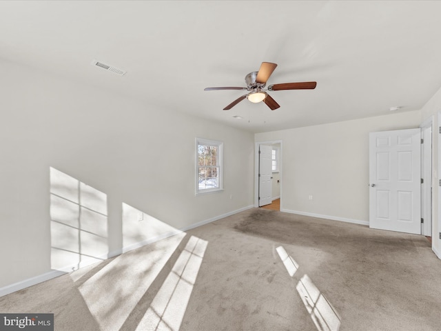 unfurnished living room with light carpet and ceiling fan