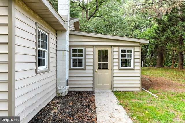 view of outbuilding featuring a yard