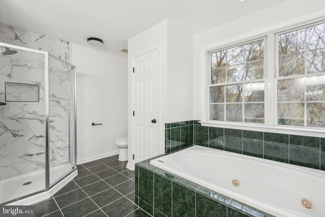 bathroom with tile patterned floors, toilet, and independent shower and bath