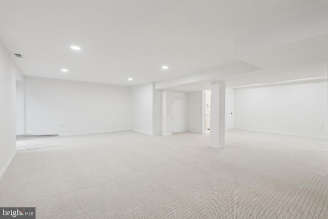 basement with light colored carpet