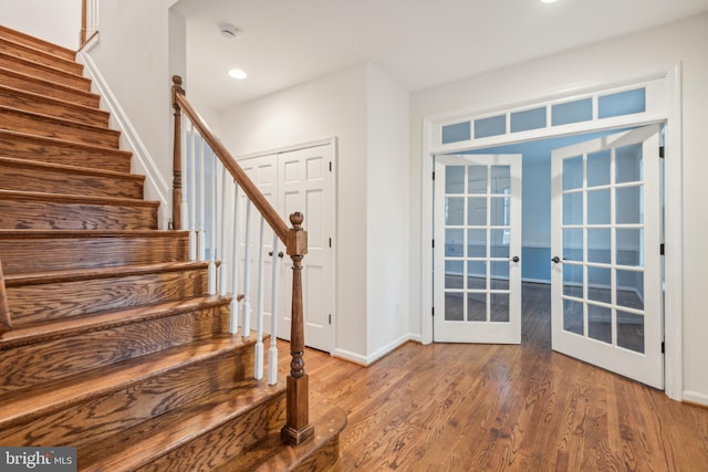 entrance foyer with hardwood / wood-style floors and french doors