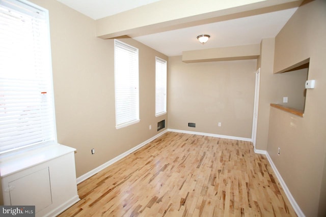 spare room featuring light hardwood / wood-style flooring