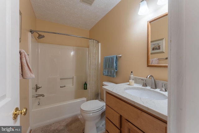 full bathroom featuring shower / bath combination with curtain, toilet, a textured ceiling, and vanity