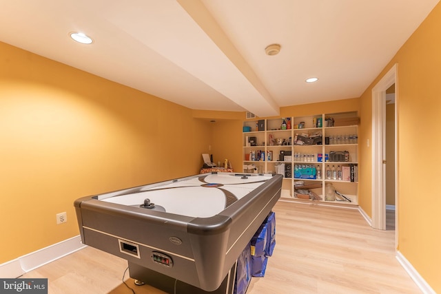 recreation room featuring light wood-type flooring