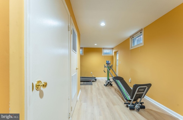 workout area featuring light hardwood / wood-style floors